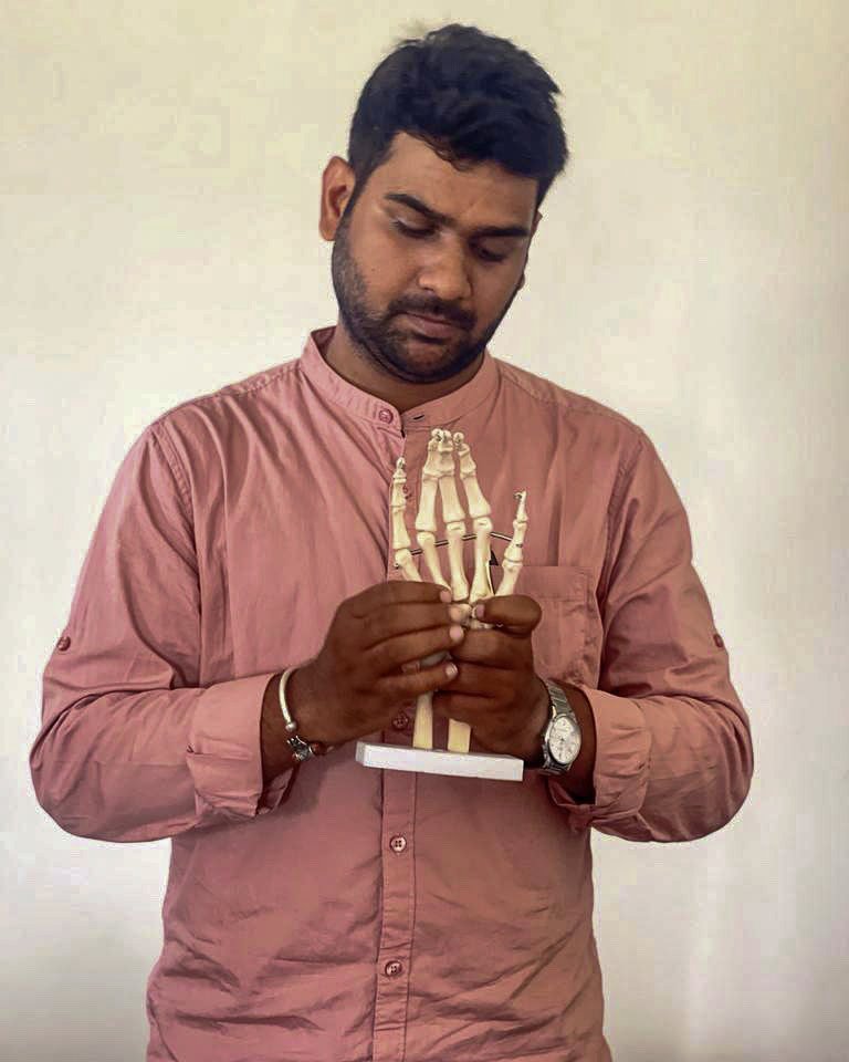 Dr. Manish Sharma explaining foot anatomy with a skeletal model