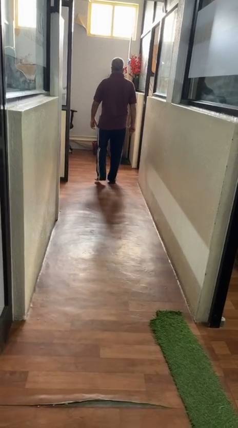 Gait re-education in the clinic corridor