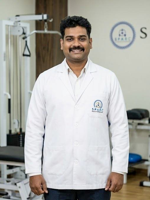 Dr. Manish Sharma in clinical attire
